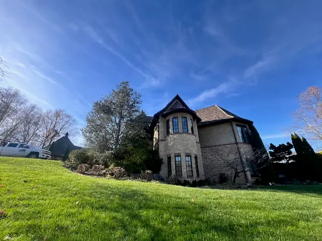 Stone Home With Asphalt Shingle Roof